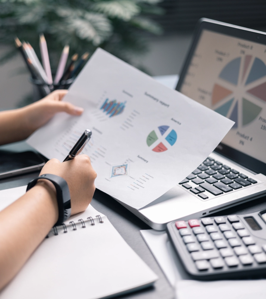 Office desk with charts and calculator