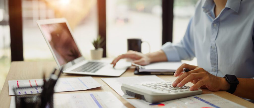 Business tasks with laptop and calculator