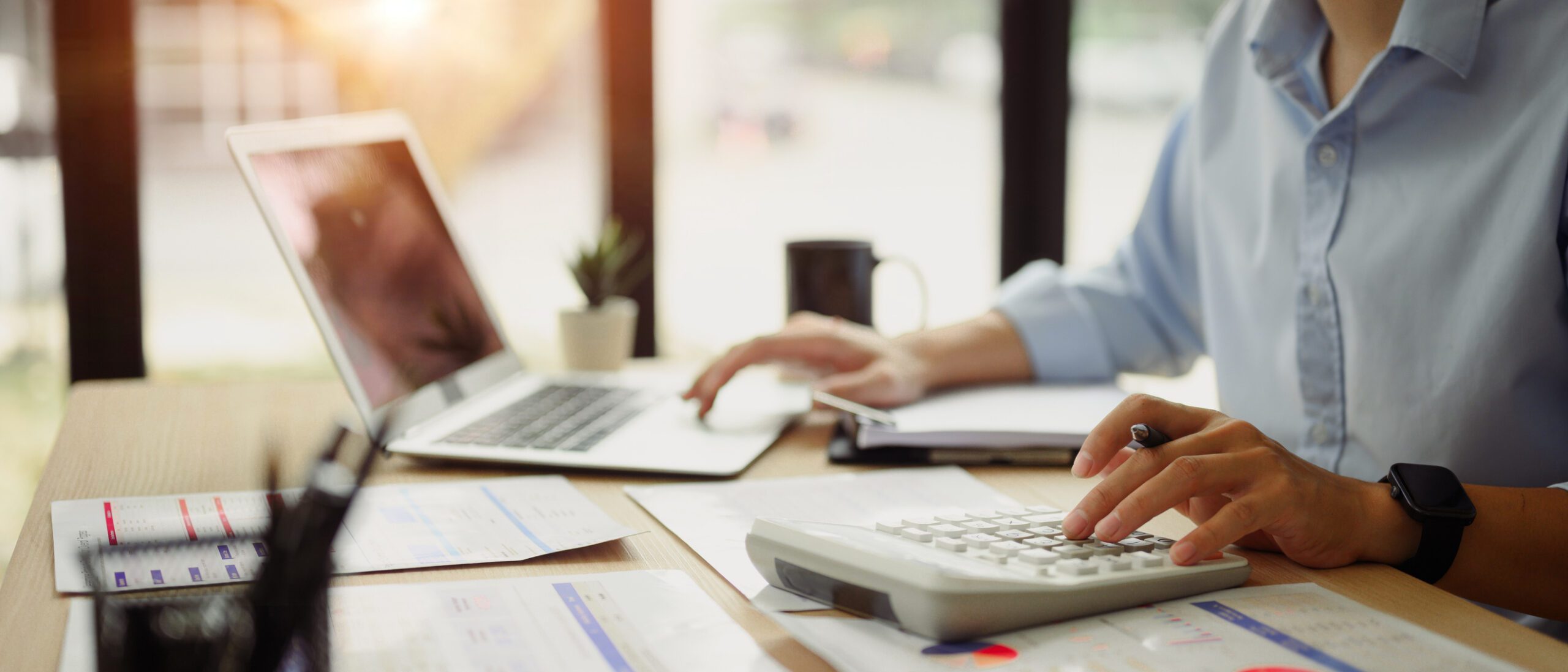 Business tasks with laptop and calculator
