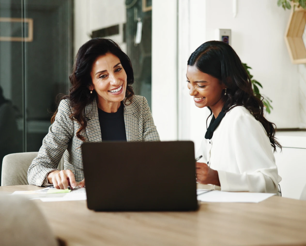 Colleagues discussing work at a table