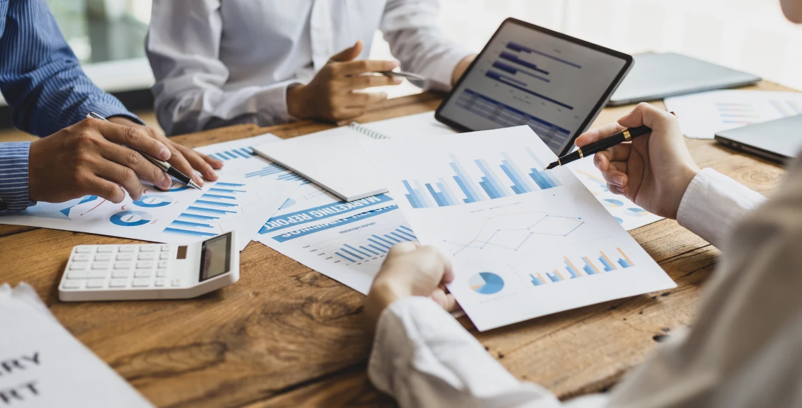 Business team analyzing financial reports
